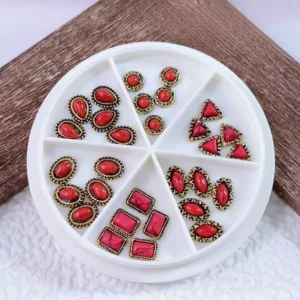 Red gemstone baroque nail art studs in multiple classic shapes