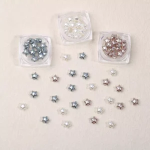 Star-shaped baroque resin nail charms in metallic pearl tones