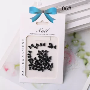 Black glossy resin bow nail charms with rhinestones – edgy nail decoration style