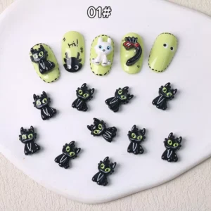 Black dragon cartoon nail charms with green eyes and glossy finish