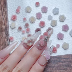 Floral-themed 3D nail design with romantic rose embellishments
