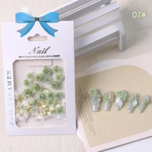 Light green rose nail decorations with clear gems and gold beads