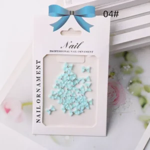 Glossy blue bow nail accessories with rhinestone centers – pastel nail decorations