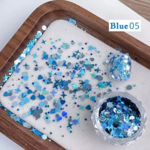 Blue holographic nail sequins with stars and moons in decorative nail tray