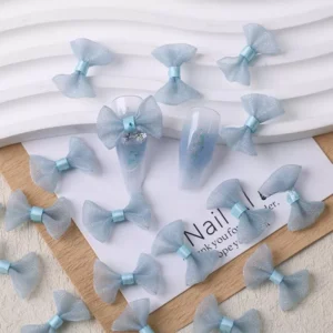 Light blue tulle bows arranged with icy nail tips