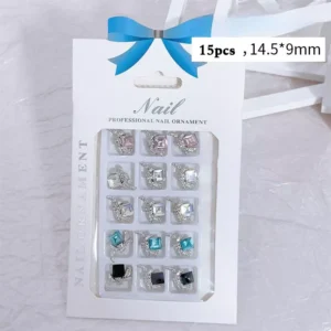 Full retail packaging of 15 bow diamond nail charms in assorted colors
