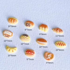 Size reference chart showing various Cartoon Bread Nail Charms from 9mm to 11mm