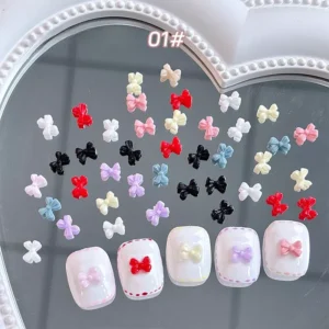 Bright jelly bow nail charms in vibrant pink, clear, and pastel hues