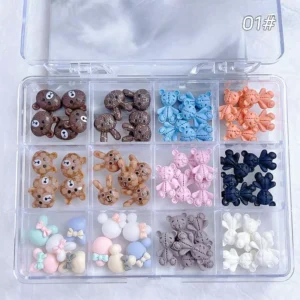 Assorted teddy bear and bunny nail charms in brown, blue, and pastel tones