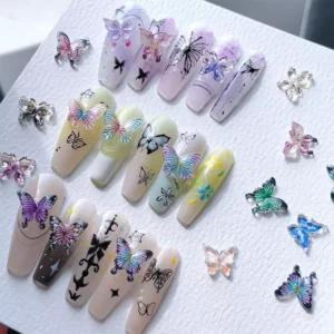 Display of nail samples decorated with various 3D colorful butterfly charms