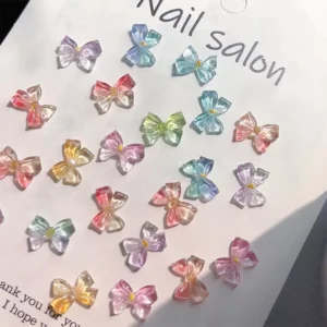 Assorted jelly bow nail charms arranged on white card labeled “Nail salon”