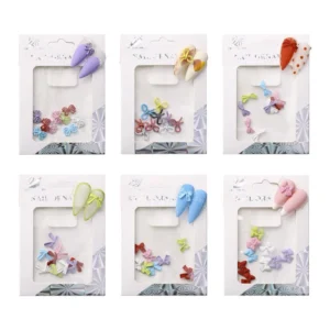 Displayed packaging of mixed resin bow nail charms with sample nails