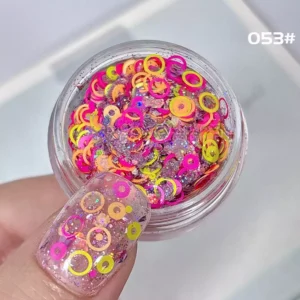 Candy-toned neon pink and orange circle sequins for nail decoration