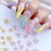 Cartoon Starfruit Nail Charms - Sweet 3D Tropical Accents 4 Close-up of pastel nail art with pink and yellow cartoon starfruit nail charms