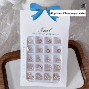Champagne color metal nail decorations in assorted shapes – 40pcs