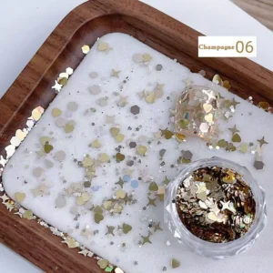 Champagne gold nail glitter in pot with holographic shapes and matching swatch