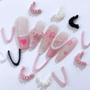Elegant nail decorations with heart motifs and resin lace edges for French tips