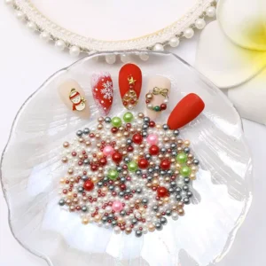 Pearl nail sequins and Christmas nail art on a shell dish