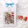 Christmas Pearl Nail Charms in festive red, green, and gold tones