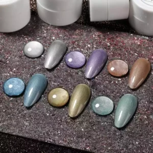 Metallic chrome gel polish swatches and drops on black stone background