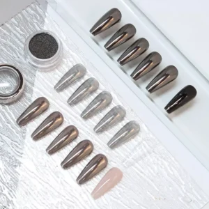 Mirror shine nail pigment applied over layered nail tips with powder jar