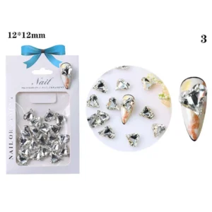 Clear faceted heart nail crystal on nude marble nail
