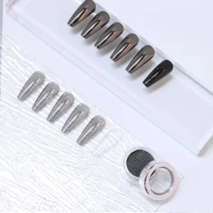 Ultra black nail chrome pigment with test swatches on clear nail tips