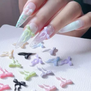Bow ribbon nail charms in multiple colors arranged for nail art