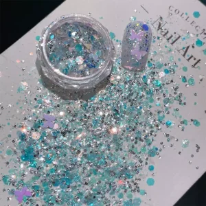 Iridescent Nail Glitter Flakes in cool teal scattered on nail art card