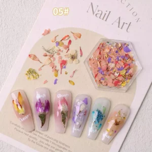 Bright mixed floral nail pieces in red, peach, and yellow with nail tips