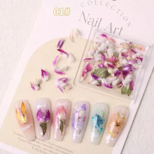 Real dried pink and white flower nail charms in a square box with applied floral nail art designs