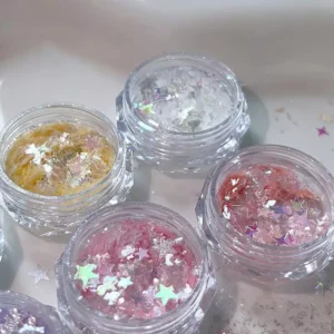 Close-up of iridescent opal nail powder with purple and silver stars