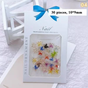 Glossy butterfly nail decorations with gold trim and colorful crystal finish