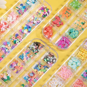 Close-up of kawaii nail decorations featuring fruit slices and mini cartoons