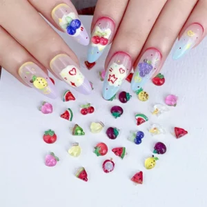 Cartoon fruit charms on long nail tips in cute pastel tones