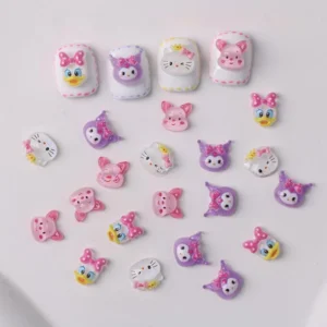 Cute pastel pink cartoon nail charms with animal characters