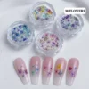 Daisy Nail Art Stickers - Cute Nails with Floral Whimsy 10 Daisy nail art stickers in clear jars with pastel flower designs and pink sample nails