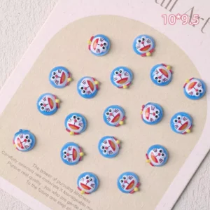 Doraemon-inspired round nail charms in blue and red
