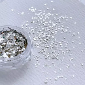 Mini dot nail glitter sequins in silver with spill effect