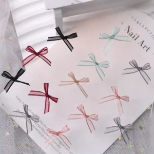 Floating lace ribbon nail bows in red, black, mint, pink, and grey