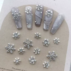 Elegant winter nails using Christmas Nail Charms and rhinestone accents