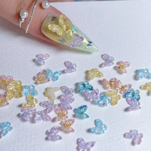 Fairy wing butterfly nail charms on white background
