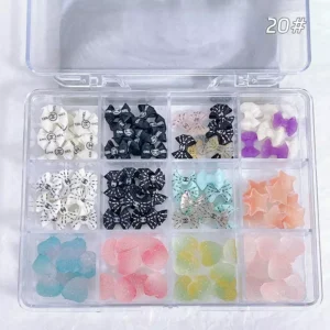 Fashion Logo Bow & Jelly Nail Charms arranged in a grid display case with assorted colorful resin pieces