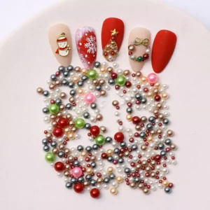 Holiday nail art design using Christmas pearl charms and sequins