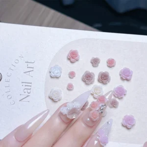 Romantic nail art using pastel rose flower charms and embellishments