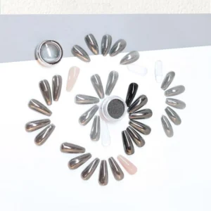 Black metallic nail dust surrounded by chrome-finish swatches in circular arrangement
