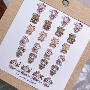 Flat layout of assorted Mikko Nail Charms in multiple designs on display card