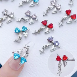 Bow dangle nail charms worn with red and blue heart gems