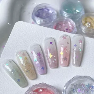 Nail art samples using Starlit Opal Nail Glitter on clear tips
