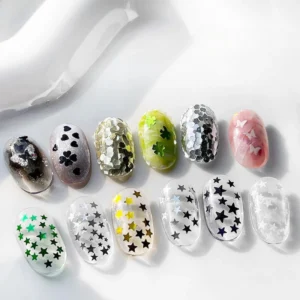 Mixed shape nail sequins with stars, hearts, and butterflies applied on nails